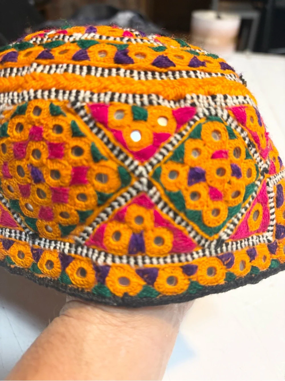 traditional handmade Balochi or Bugti cap featuring vibrant yellow embroidery